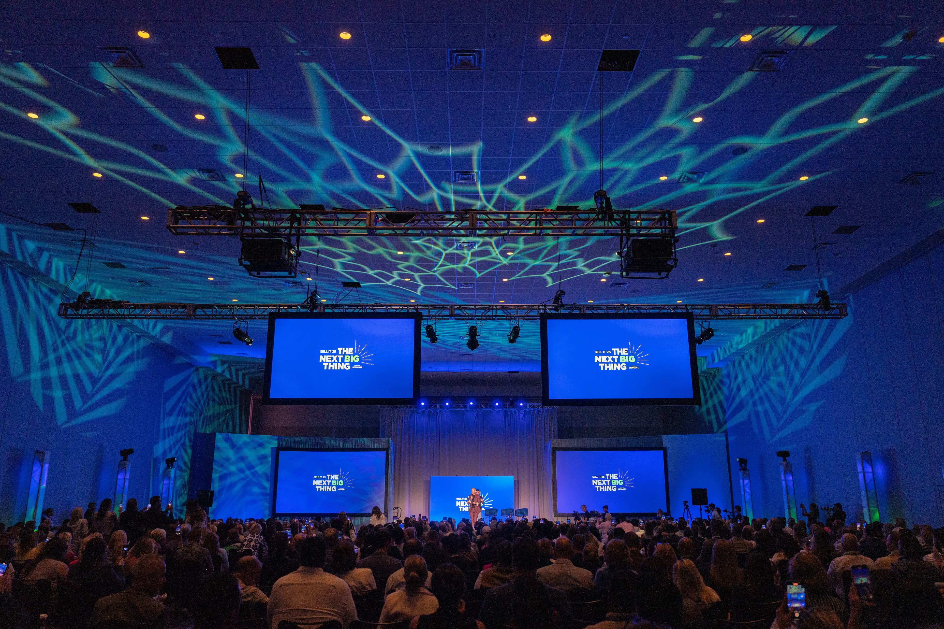 Sell It '26 general session — a packed ballroom facing the main stage in Denver